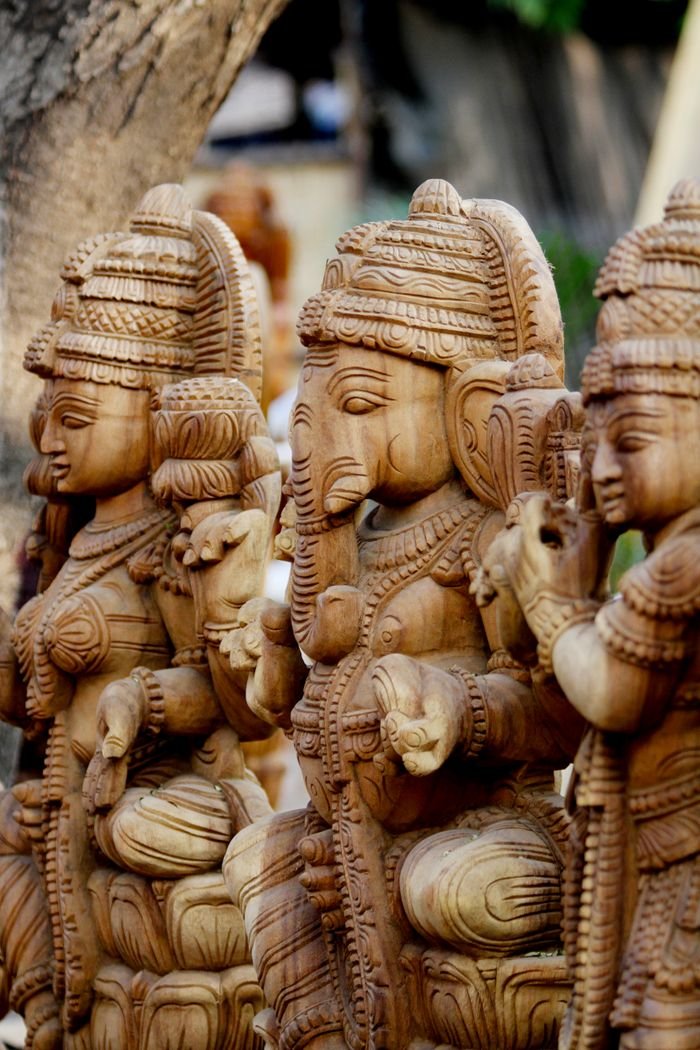 our-services-1 Intricate wooden Ganesha statues carved with detailed craftsmanship, symbolizing spirituality and art.