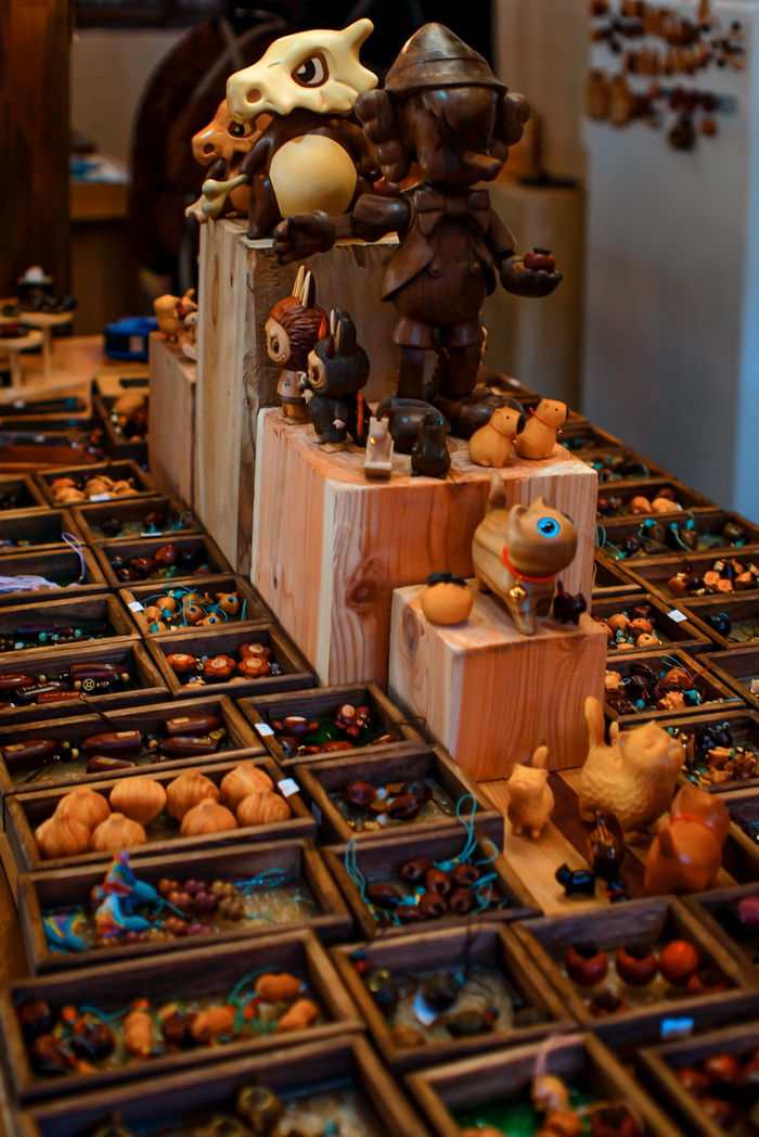 Mastering the First Impression: Your intriguing post title goes here Colorful wooden animal figurines on display at an artisan market stall, featuring diverse handcrafted designs.